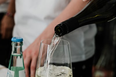 White wine being poured into a glass